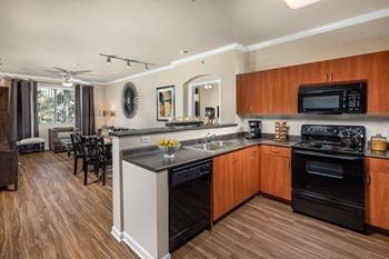 Warm cherry cabinetry with satin nickel hardware